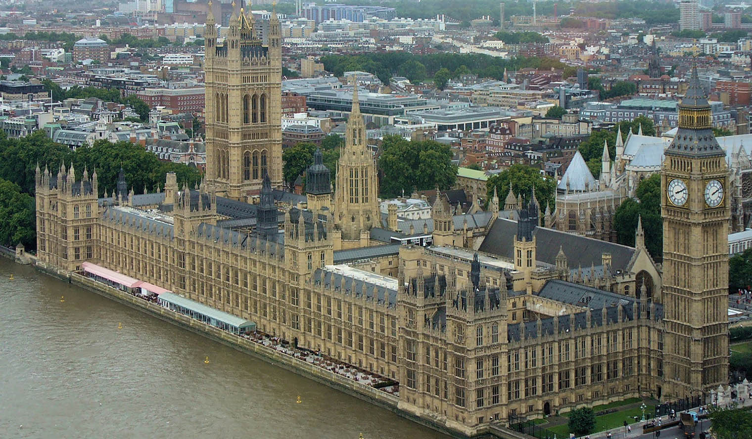 The Thames River and Westminster Palace, which houses the Houses of Parliament, from above.