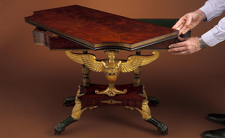 Two side by side views of a card table.