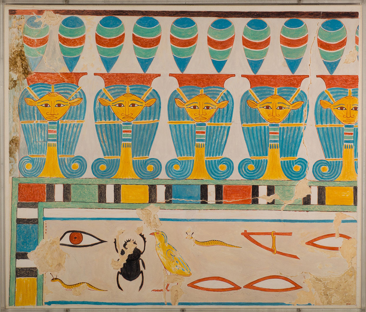 Colorful design with women's heads wearing curled wigs and a line of hieroglyphs.