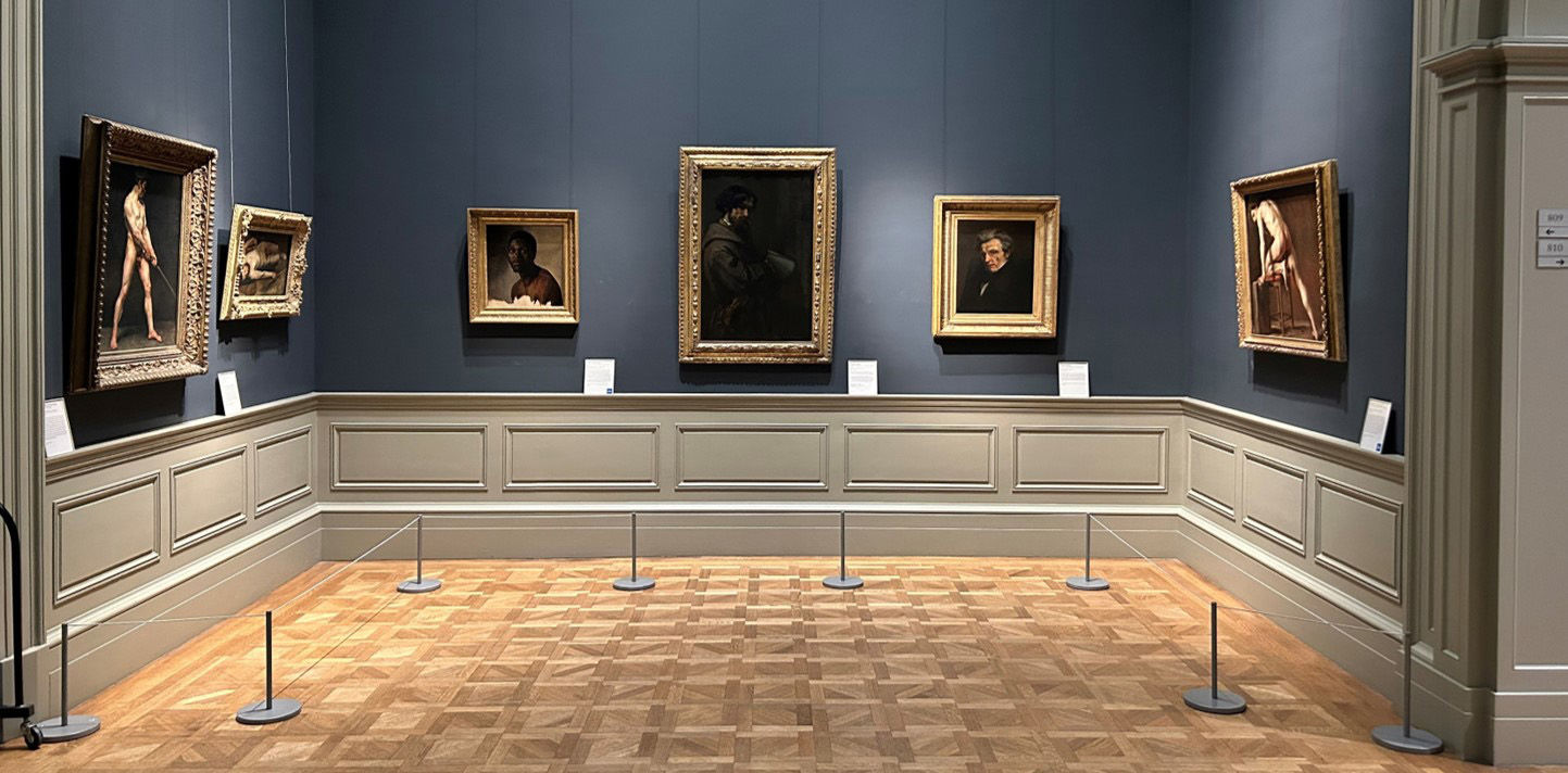 A view of Gallery 809 Showing the following Paintings left to right: A follower of Pierre Narcisse Guerin's "Study of a Nude Man", Degas's "Male Nude", Biard's "Bust-Length Study of a Man", and Courbet's "Alphonse Promayet", "Monsieur Suisse", and "Study of a Nude Man".