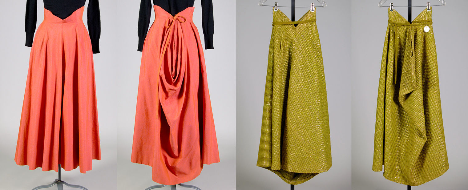 Front and back views of two above-the-ankle-length skirts with waistlines that form a “V” in front and back and curve up over the ribs on the side. The pinkish-orange skirt at left falls in undulating folds at the front and is draped in bustle-like swags at the back. On the right, the pea-green skirt is stiffer, with fewer folds at front and a more angular back drape. 