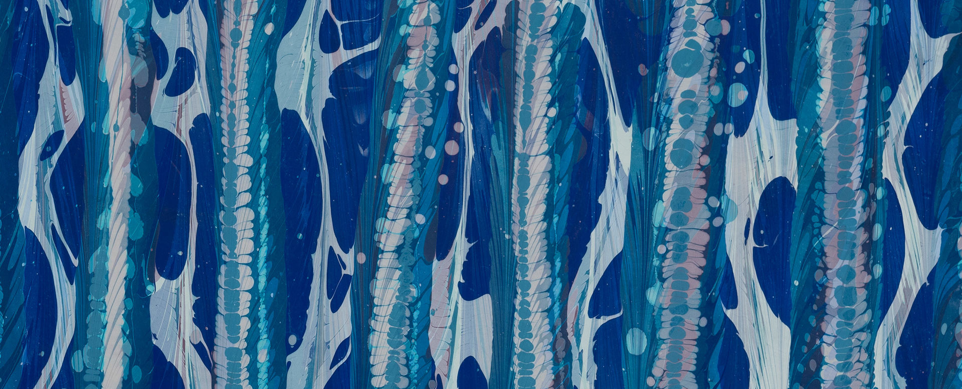 Detail of marbled paper in shades of blue and pink