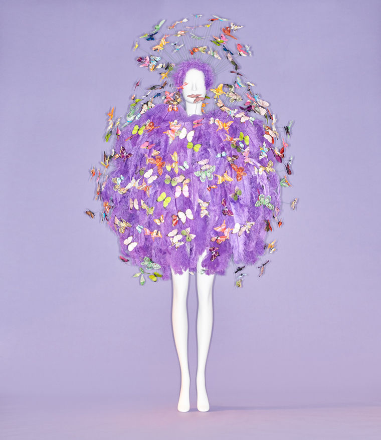 Couture ensemble of purple feathers adorned with bejeweled butterflies