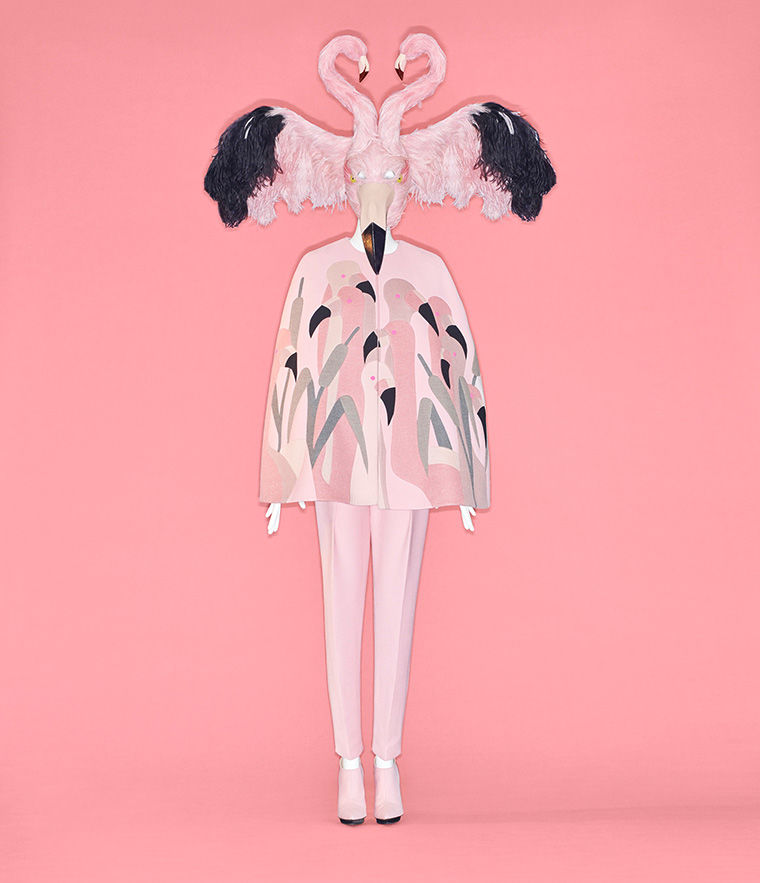Couture ensemble made of pink fabrics, with a headpiece resembling two flamingos facing each other