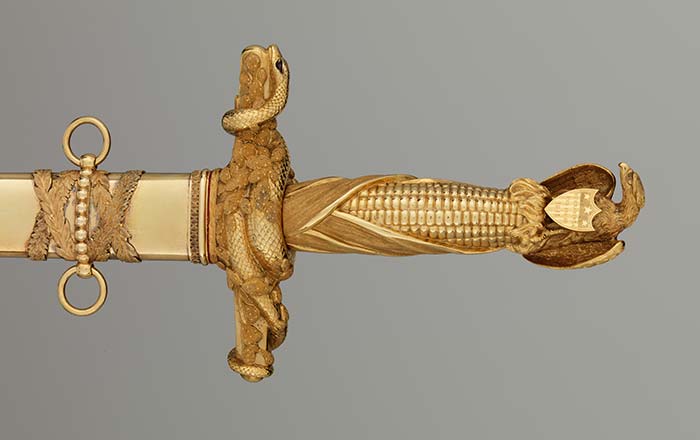 Congressional Presentation Sword and Scabbard of Major General John E. Wool made out of Steel, gold, brass, diamonds, rubies. The massive gold hilt incorporates the American eagle as the pommel, an ear of corn for the grip, and a cactus branch entwined with snakes (for Mexico) as the cross-guard. 