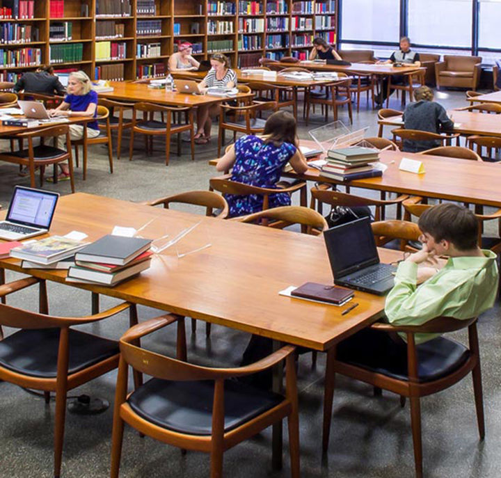 Adults reading in the Thomas J. Watson Library
