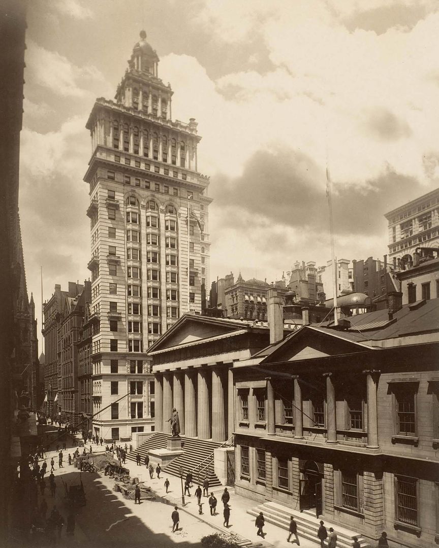 A sepia photo of an early skyscraper