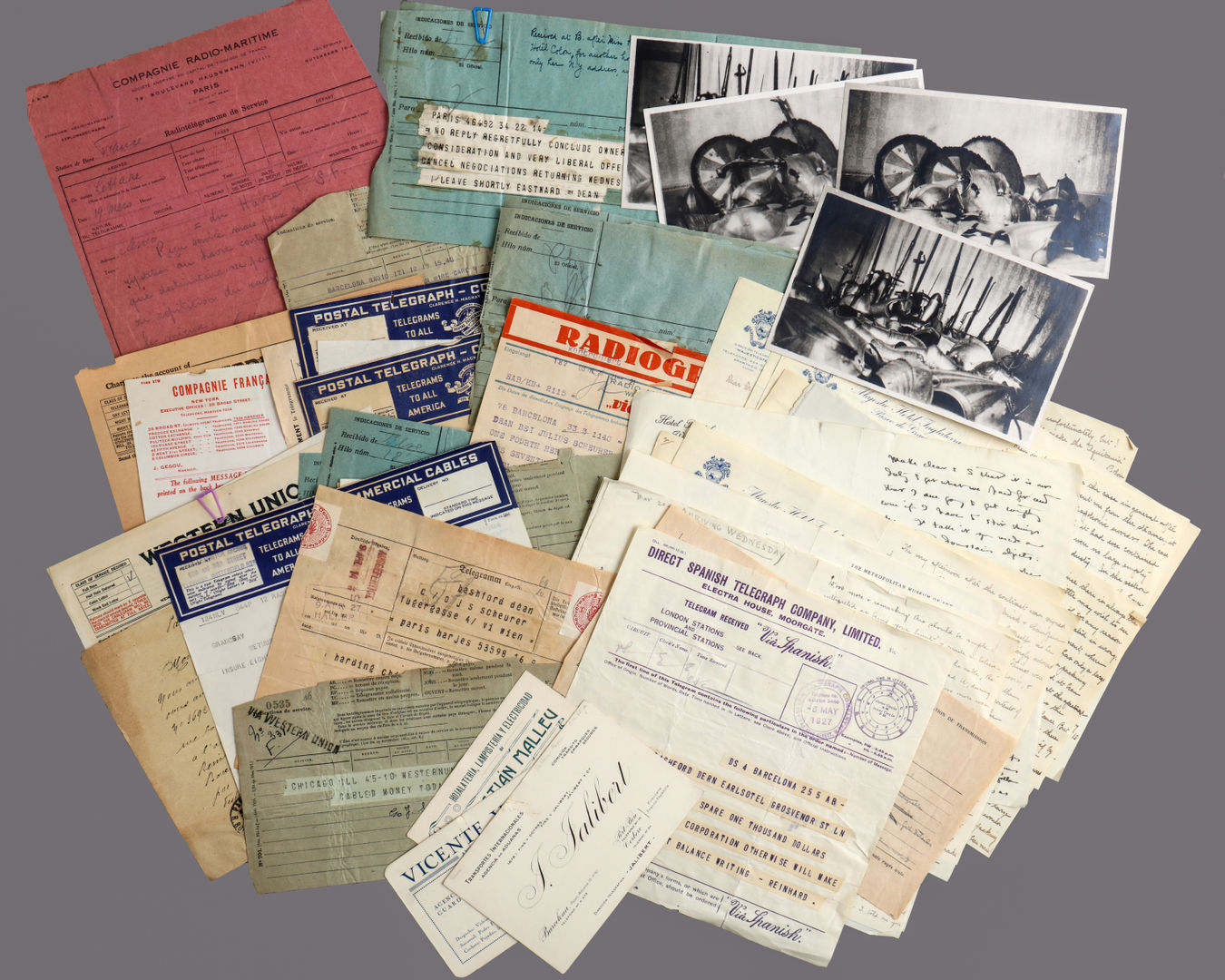 Various ephemera and correspondence photographed on a light gray background
