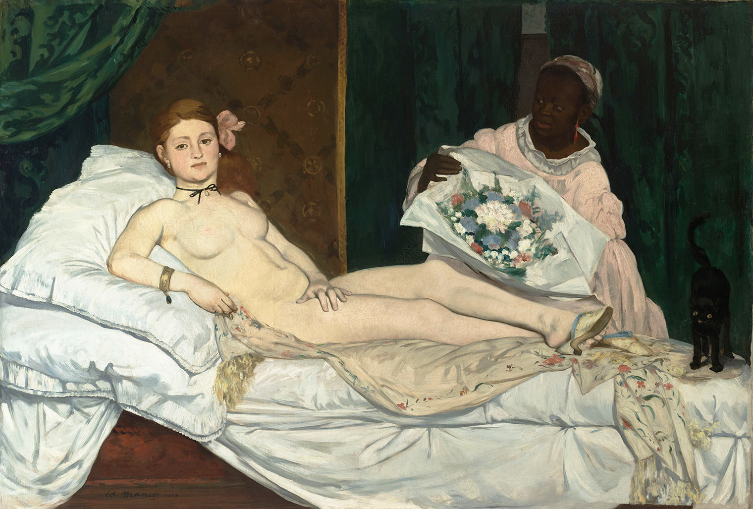 A nude woman reclines in bed and is attended to by a servant.
