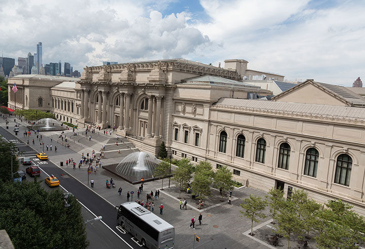 Photograph of The Metropolitan Museum of Art facade against a cloudy sky.
