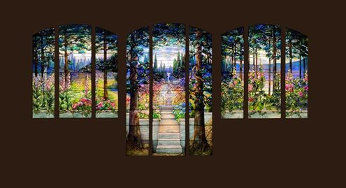 Three stained glass window panels with curved tops depicting trees in a wooded landscape