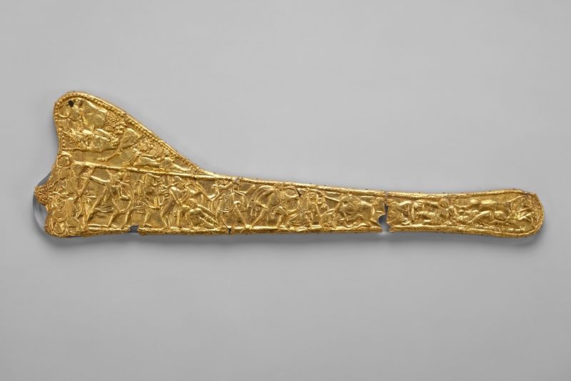 Scythian gold scabbard. The main frieze in embossed relief features a battle scene between Greeks and undetermined barbarians.