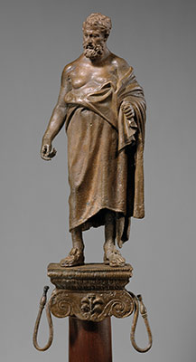 Bronze statuette of a philosopher on
                              a lamp stand
