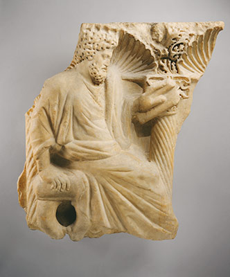 Fragment of a sarcophagus with a seated figure