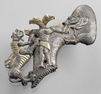 Shaft-hole axhead with a bird-headed demon, boar, and dragon