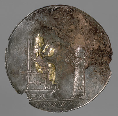 Medallion with a seated deity and a male worshipper