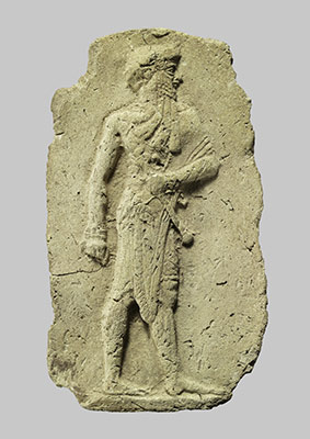 Molded plaque: king or a god carrying a mace