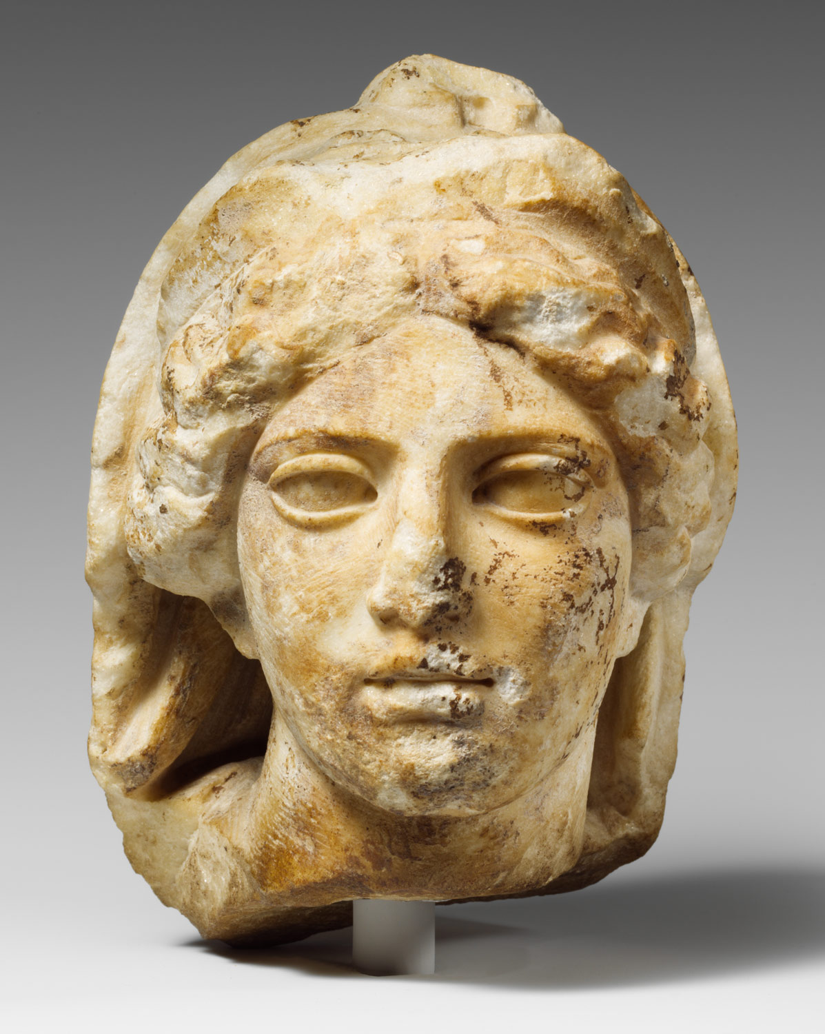 Marble head of a woman wearing diadem and veil