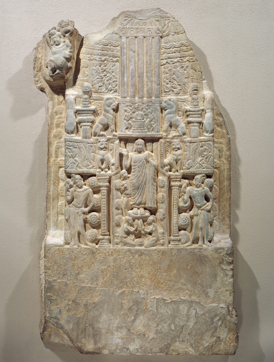 Drum Slab Showing the Buddha Standing in the Gateway of a Stupa