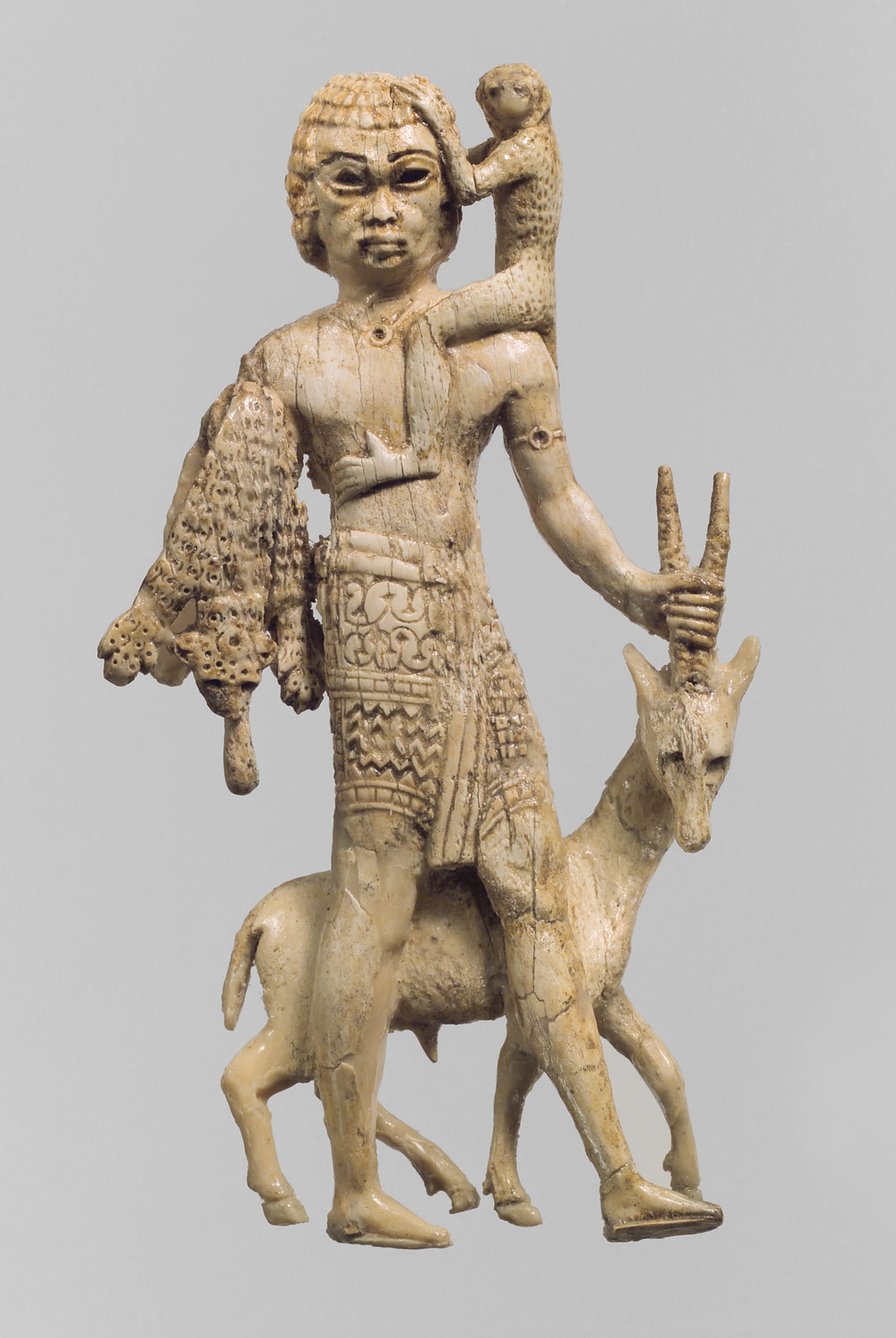 Tribute bearer with an oryx, a monkey, and a leopard skin