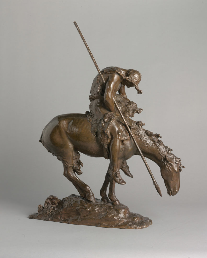 A bronze sculpture of a man with a long spear slumped forward while seated on a tired horse