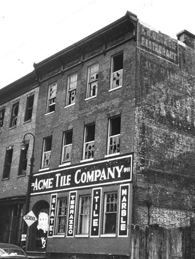 Archival photograph of the brick exterior of the Acme Tile Company in Baltimore from the 1950s