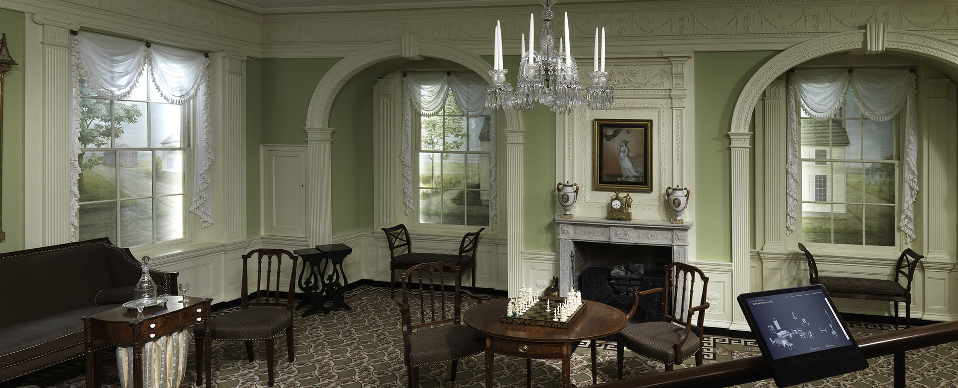 The Benkard Room as installed at the Met, complete with historically appropriate furniture, a chess set, fireplace, and chandelier.