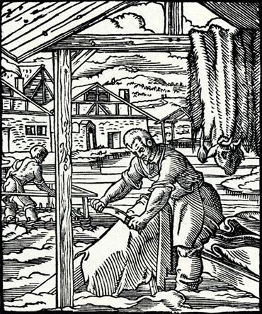 A woodcut showing a tanner cleaning a skin with a beaming, or fleshing, knife
