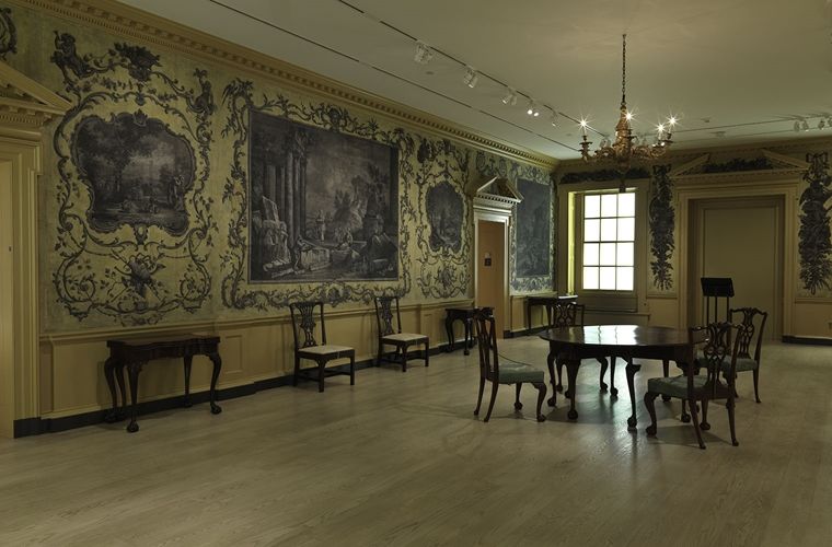 A photograph of Van Rensselaer Hall, installed in the Met.