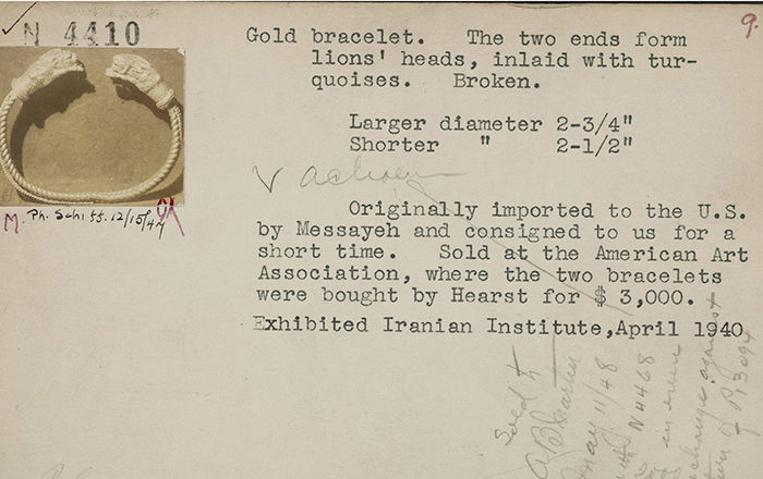 Two similar golden bracelets float side by side