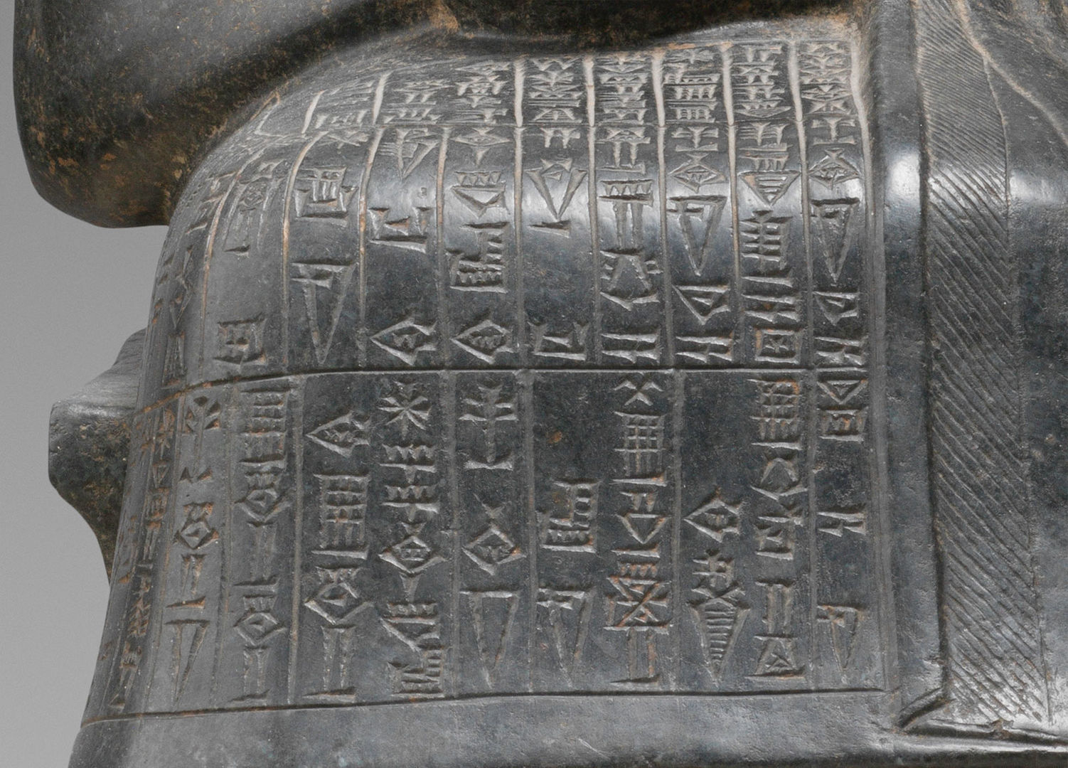 Detail of Statue of Gudea (59.2), showing cuneiform inscription that reads in part: “Gudea, the man who built the temple, may his life be long".
