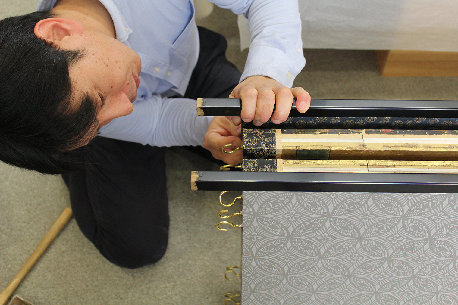 Visiting conservator from Japan working on an artwork