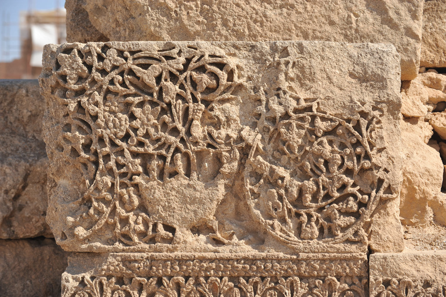 Fragment Carved with Vine Scroll and a Vase