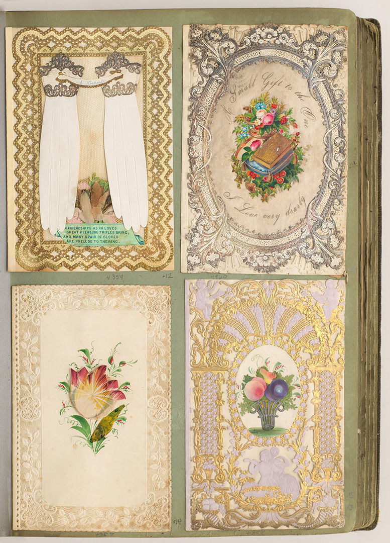 Album page with four paper lace gilt and collaged valentines attached.