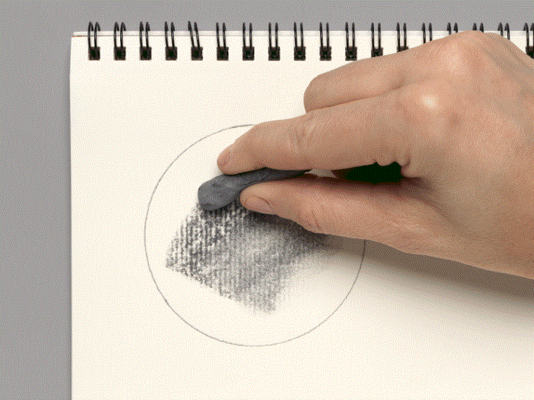 A moving image of a hand wiping away charcoal marks on paper with an eraser.