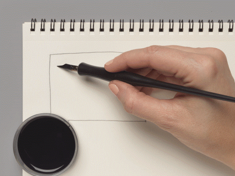 A moving image of both a pen and a brush making squiggly lines on a notebook page.