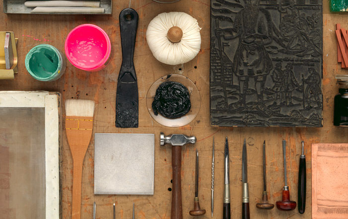 A table of printmaking materials and tools