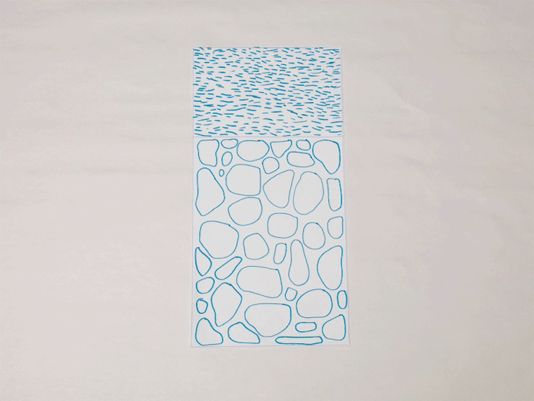 Animated image of a drawing being placed onto an uncut block