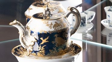 A jar shaped like a grotesque bird.