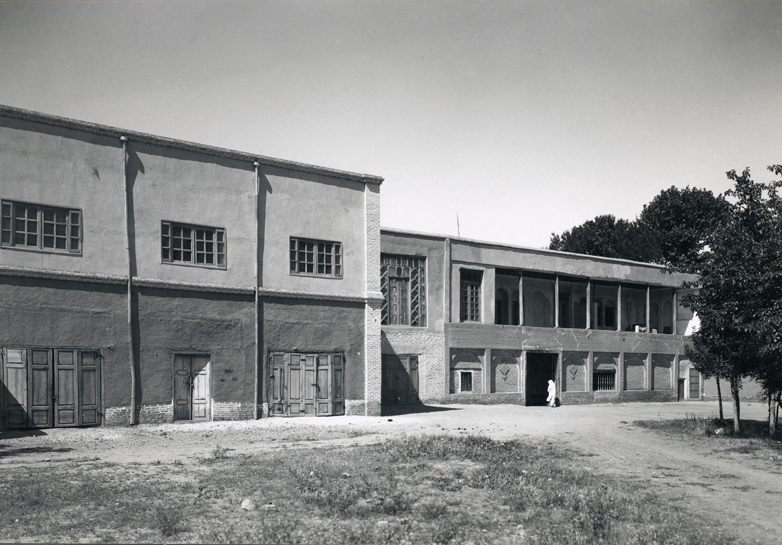 black and white image of the exterior of the excavation house