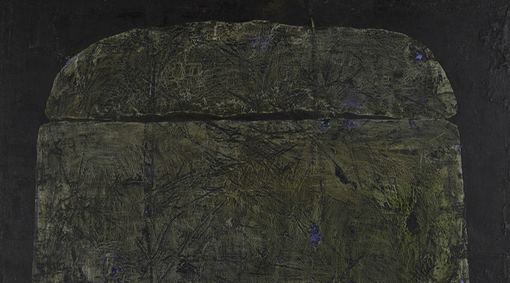 An imposing and ambiguous mound centrally positioned against a dark backdrop.