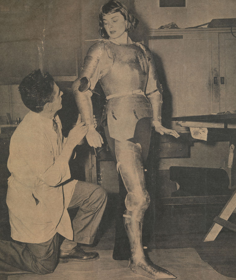 Leonard Heinrich fits Ingrid Bergman in armor