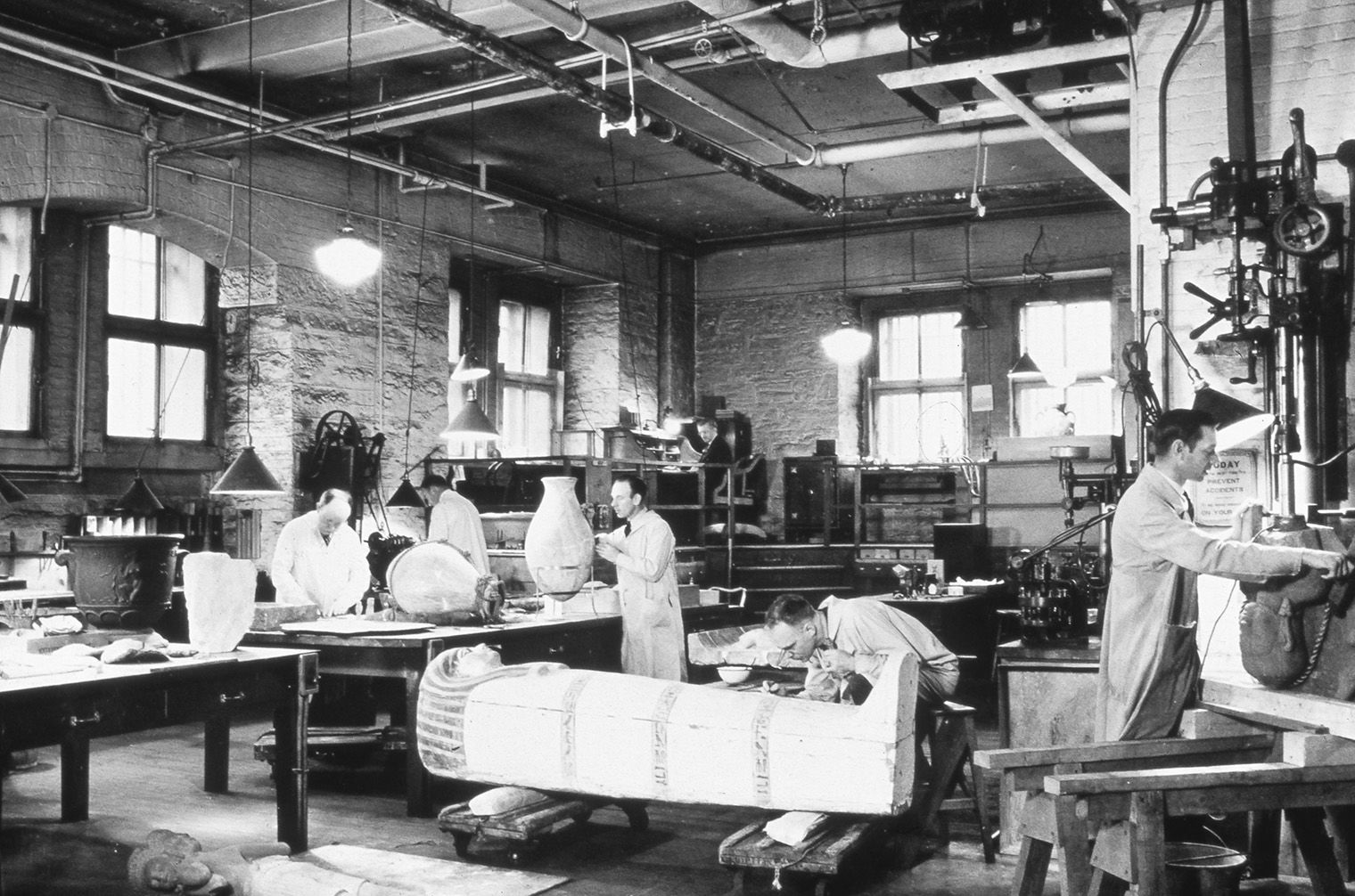Objects conservators working in the Museum's repair shop in 1936.