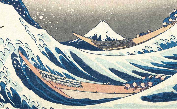 Detail of the Great Wave showing two boats on whitecapped blue waves with Mount Fuji in the distance