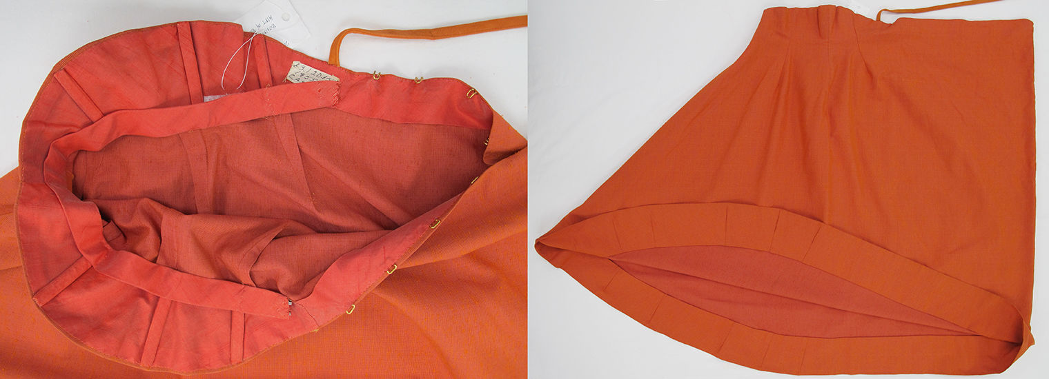 At left, an interior view of the orange skirt’s waistline and center back closure. The waist and hip areas are shaped by three darts on each side. Above the natural waist and along the back closure, the skirt is lined with red-orange bias-cut shantung which covers the upper half of the darts. Bones encased in bias tape are sewn on top of the lining in line with the underlying darts. A waist stay is sewn into the center front of the skirt and tacked to each of the bones. The back ends of the waist stay are not sewn down and close with metal hooks and thread eyes. At right, the orange skirt is laid flat on a table with the bias-cut center front seam towards the left and the center back fold on the right. The hem is turned up to show a four-inch seam allowance with several darts along the curved edge. 
