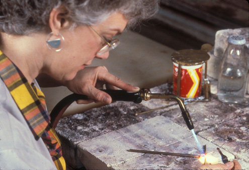 Installer Sandy Walcott manufacturing brass mount, 1988