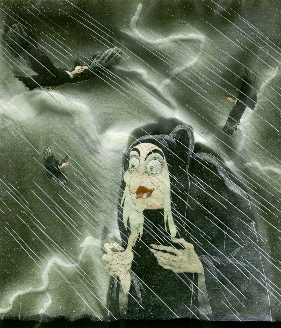 A witch in the rain with vultures flying overhead.