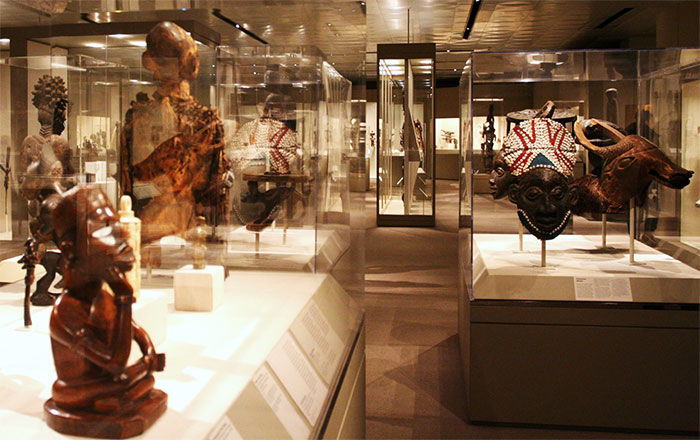 View of African art gallery showing objects in glass display cases