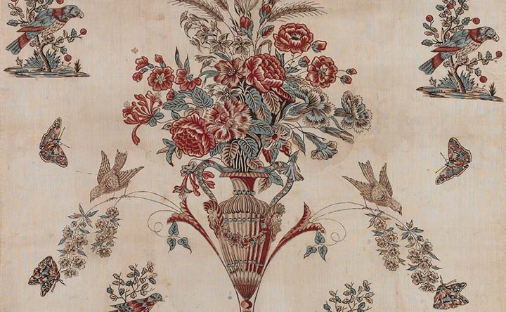 Cotton quilt with a vase full of flowers surrounded by butterflies and birds