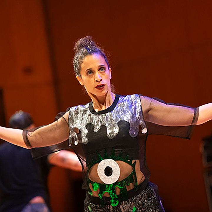 Alethea Pace stands with both arms outstretched in performance at MetFest.